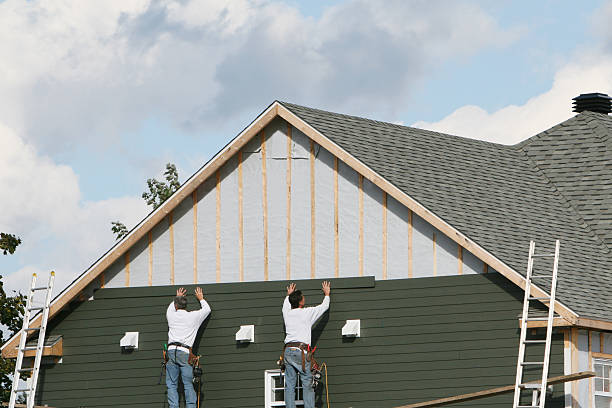 Professional Siding technician working in Redmond, WA